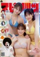 A group of three women in bikinis on a magazine cover.